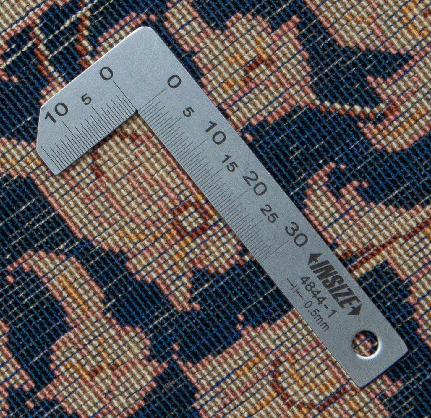 Eine Fotoaufnahme eines Ghom Teppichs.