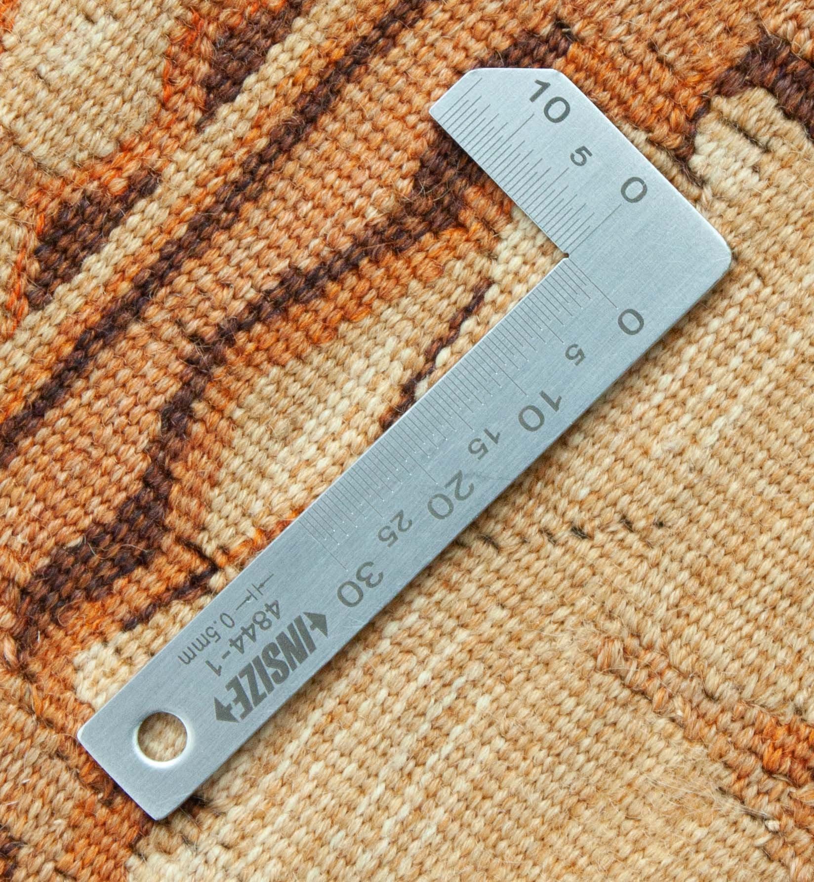 Eine Fotoaufnahme eines Tapisserie Teppich Teppichs.