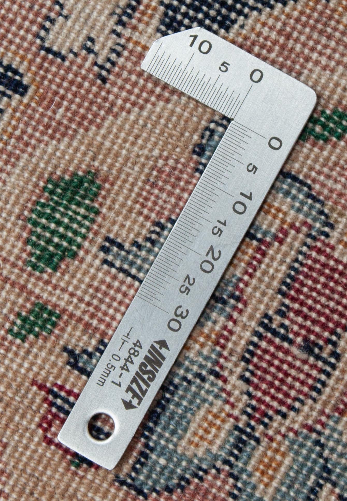 Eine Fotoaufnahme eines Täbriz Teppichs.