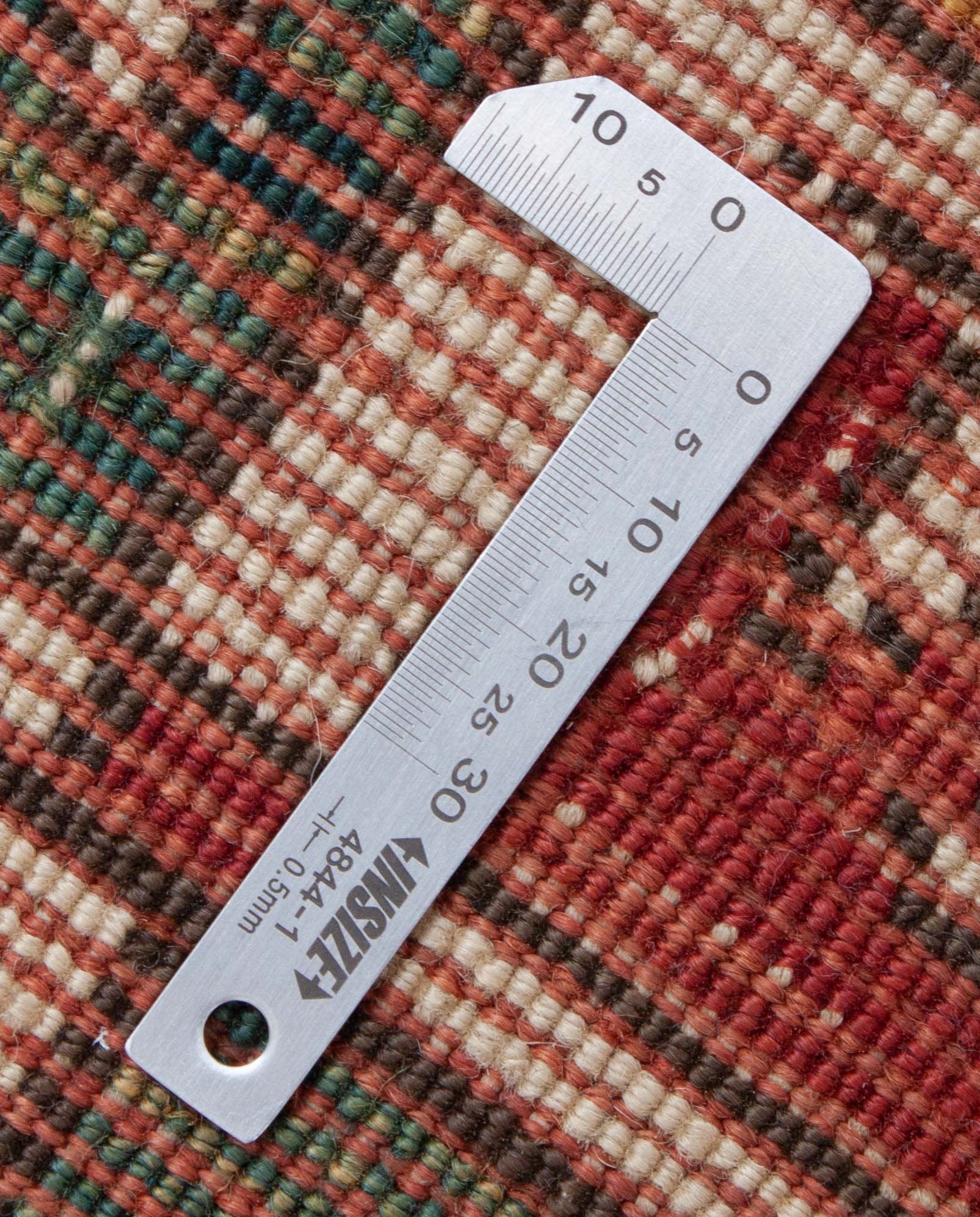 Eine Fotoaufnahme eines Kazak Teppichs.