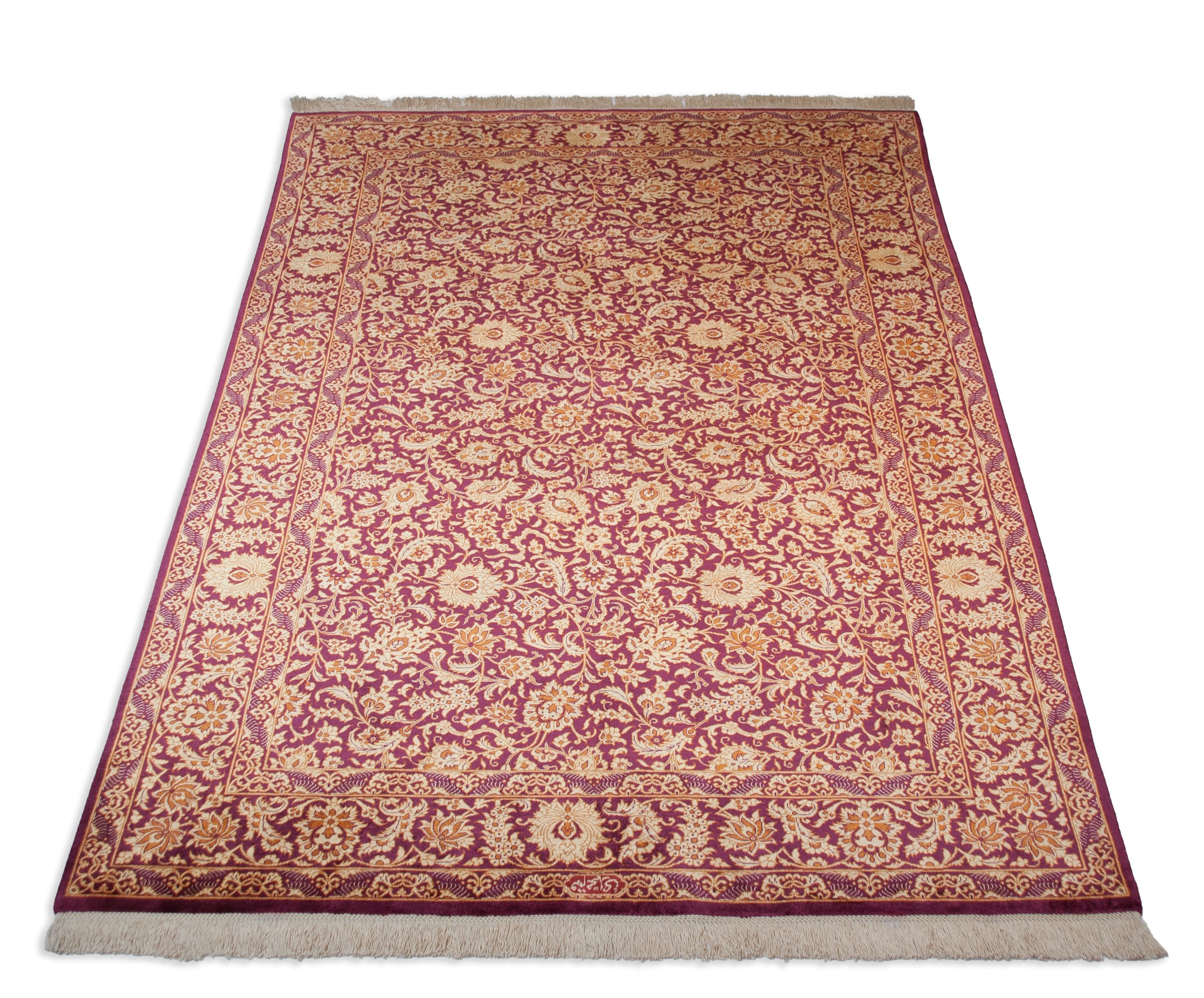 Eine Fotoaufnahme eines Ghom Teppichs.