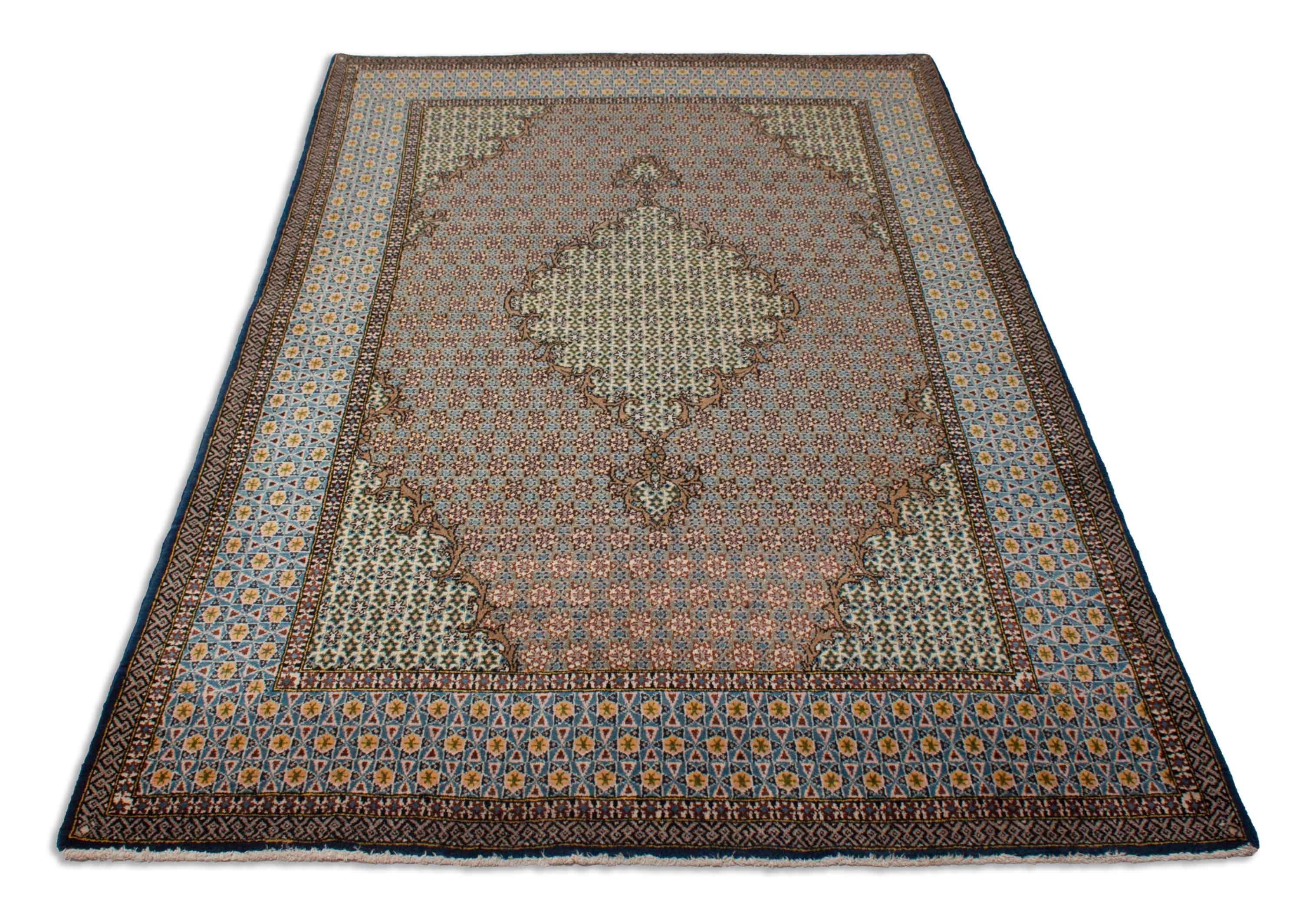 Eine Fotoaufnahme eines Ghom Teppichs.