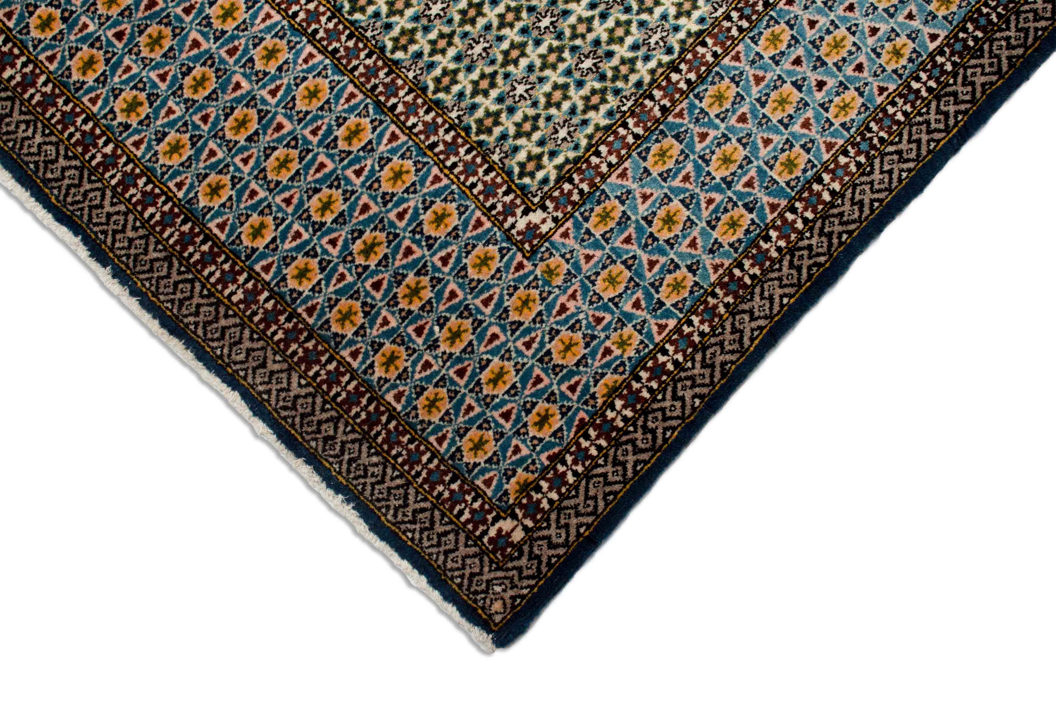 Eine Fotoaufnahme eines Ghom Teppichs.