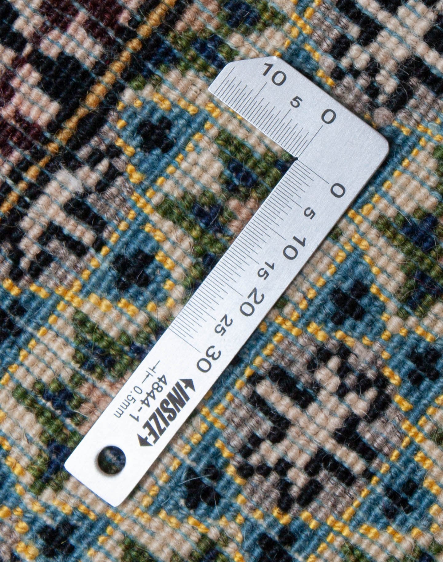 Eine Fotoaufnahme eines Ghom Teppichs.