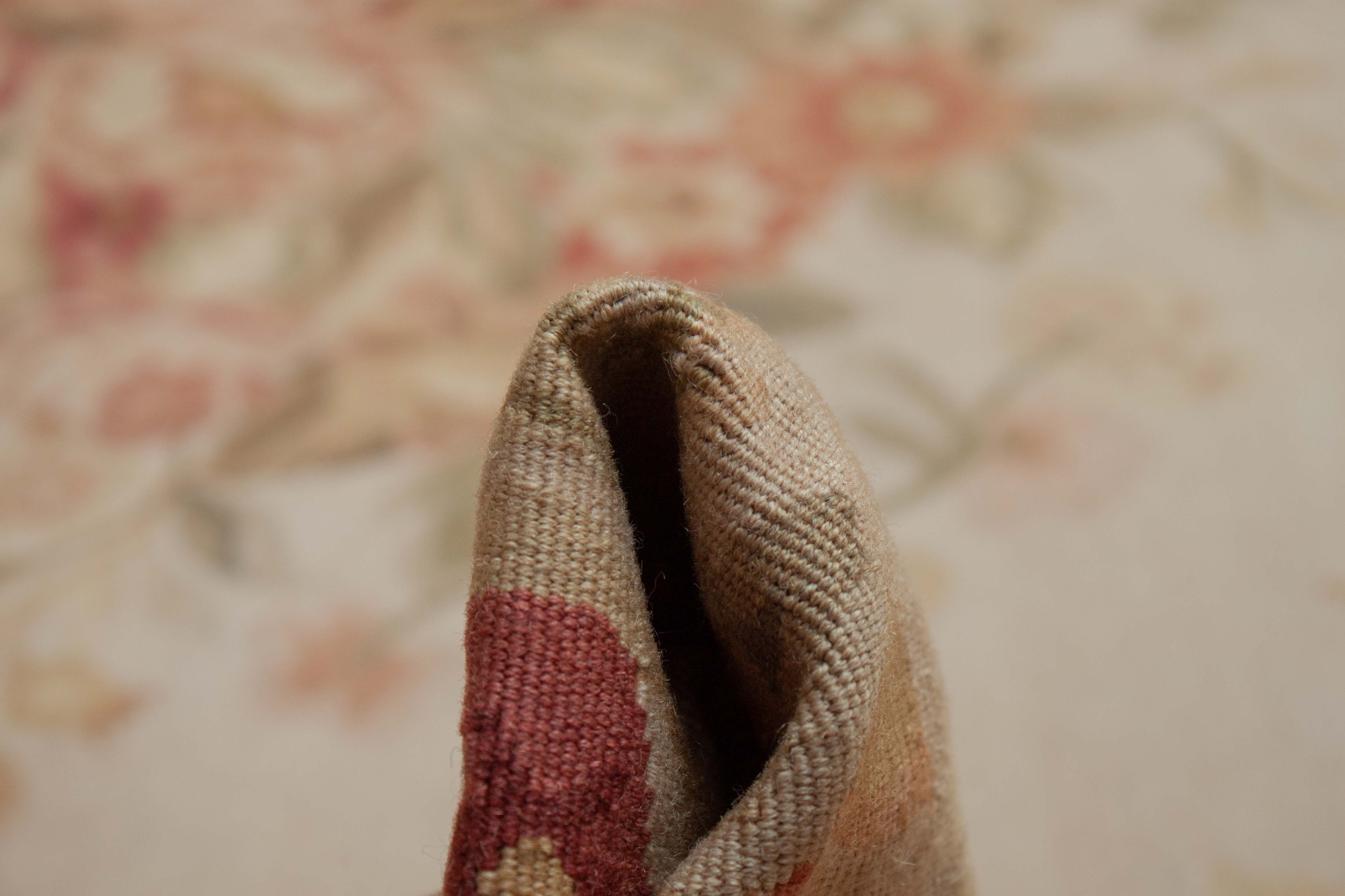 Eine Fotoaufnahme eines Aubusson Teppichs.