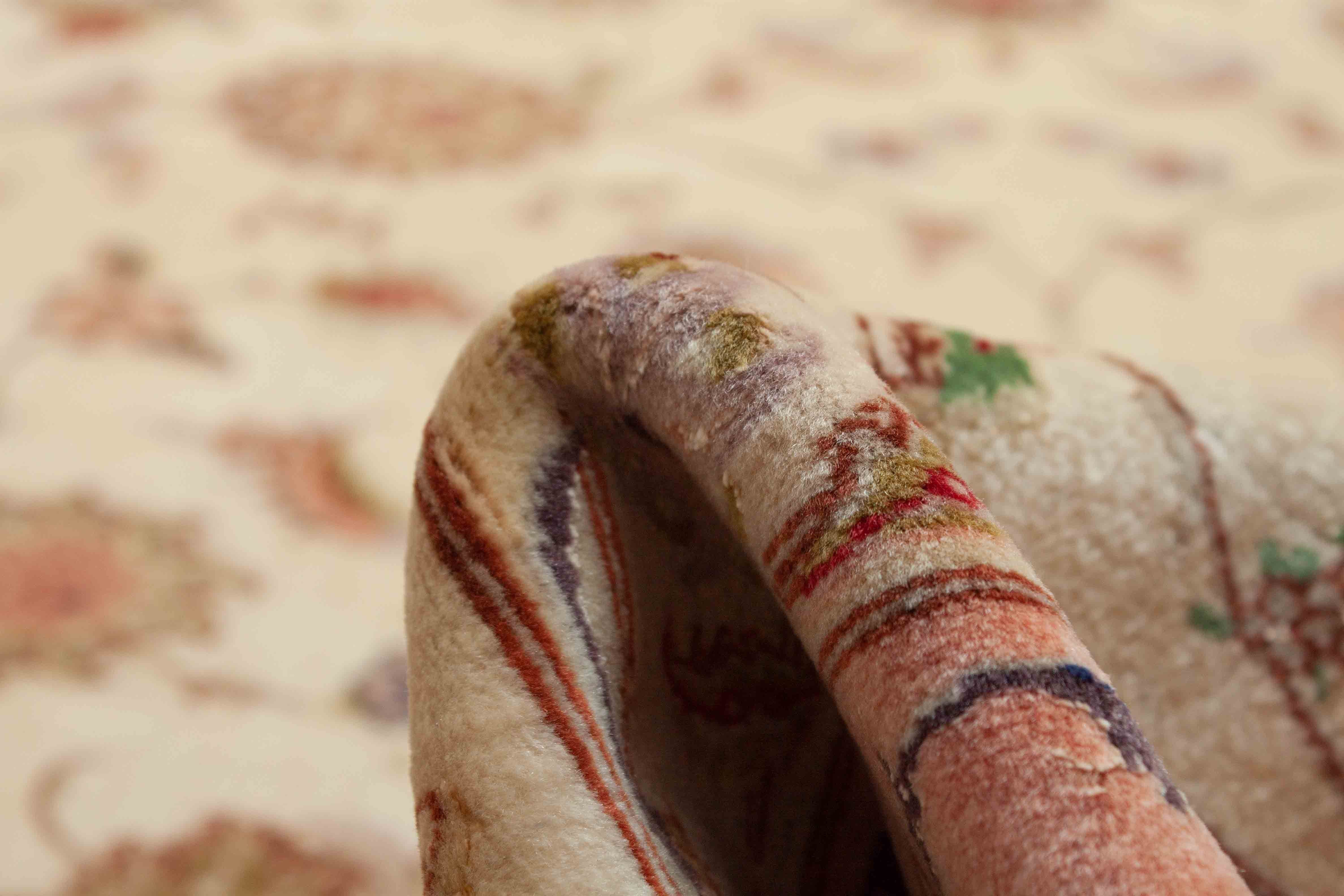 Eine Fotoaufnahme eines Täbriz Teppichs.