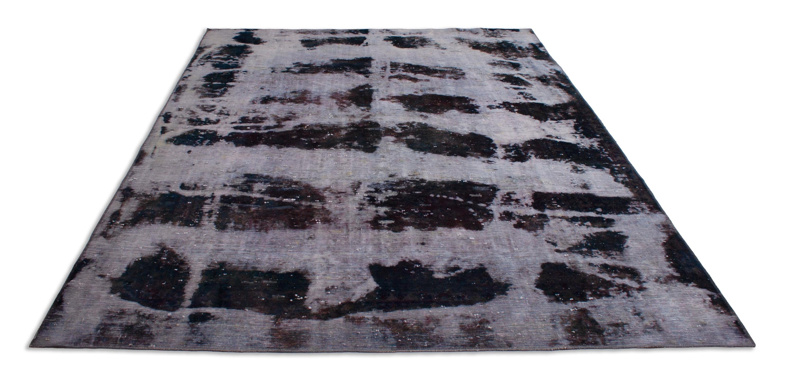 Eine Fotoaufnahme eines Vintage Teppich Teppichs.