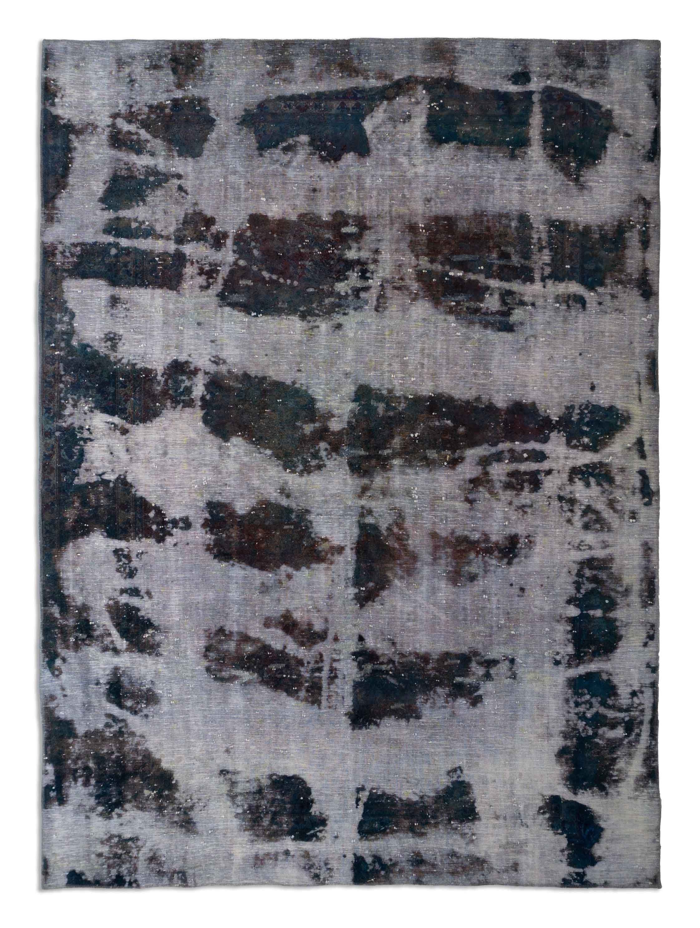 Eine Fotoaufnahme eines Vintage Teppich Teppichs.