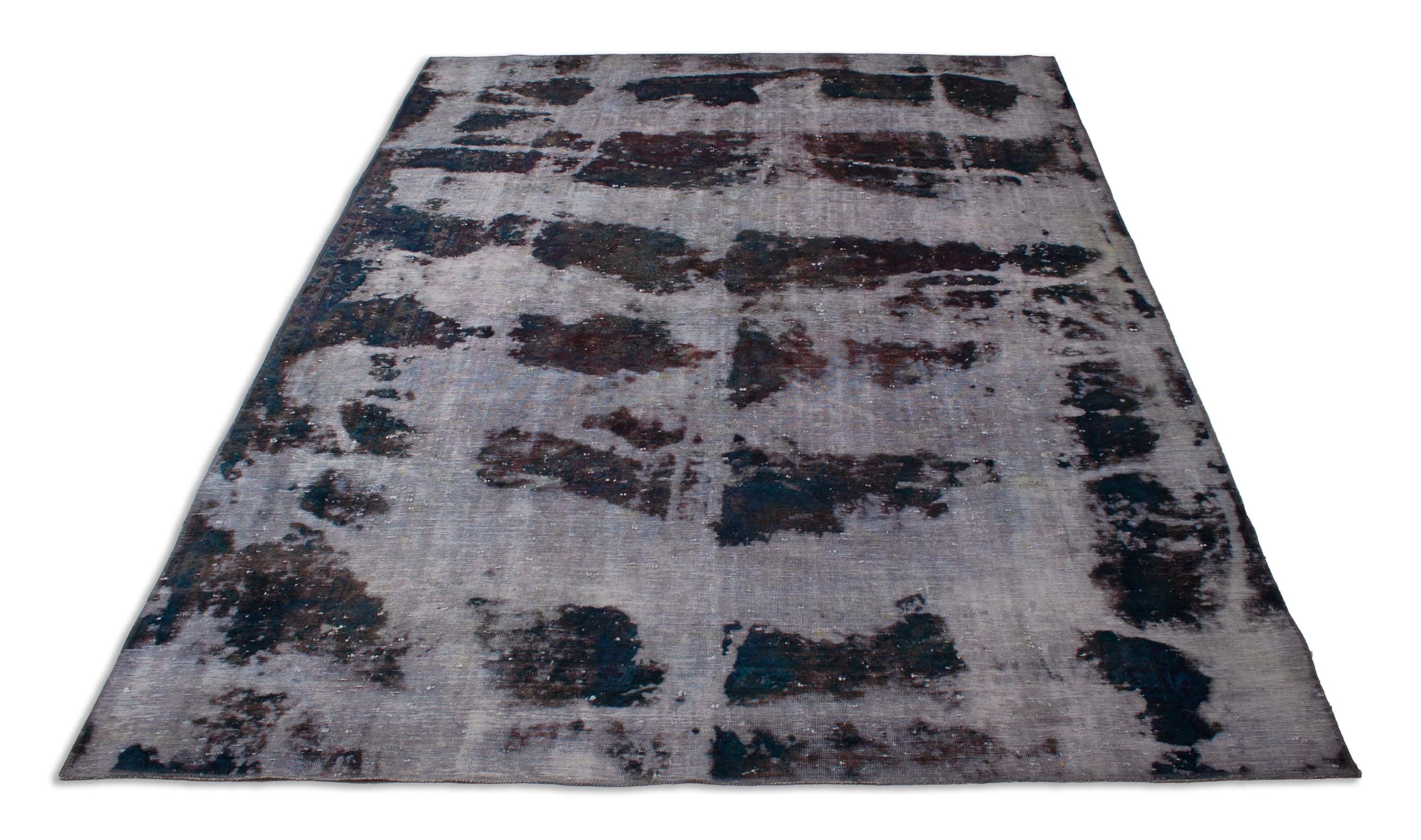 Eine Fotoaufnahme eines Vintage Teppich Teppichs.