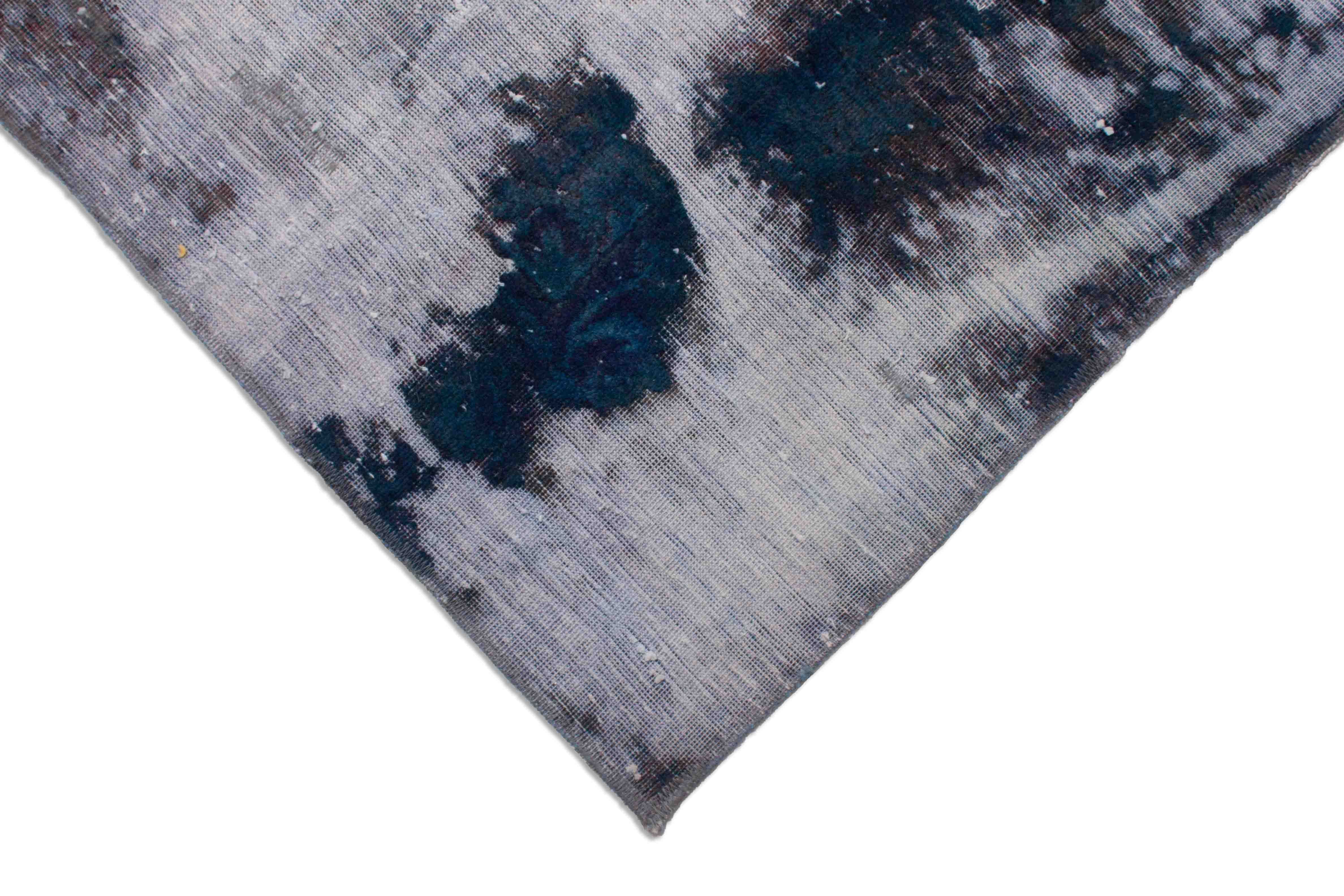 Eine Fotoaufnahme eines Vintage Teppich Teppichs.