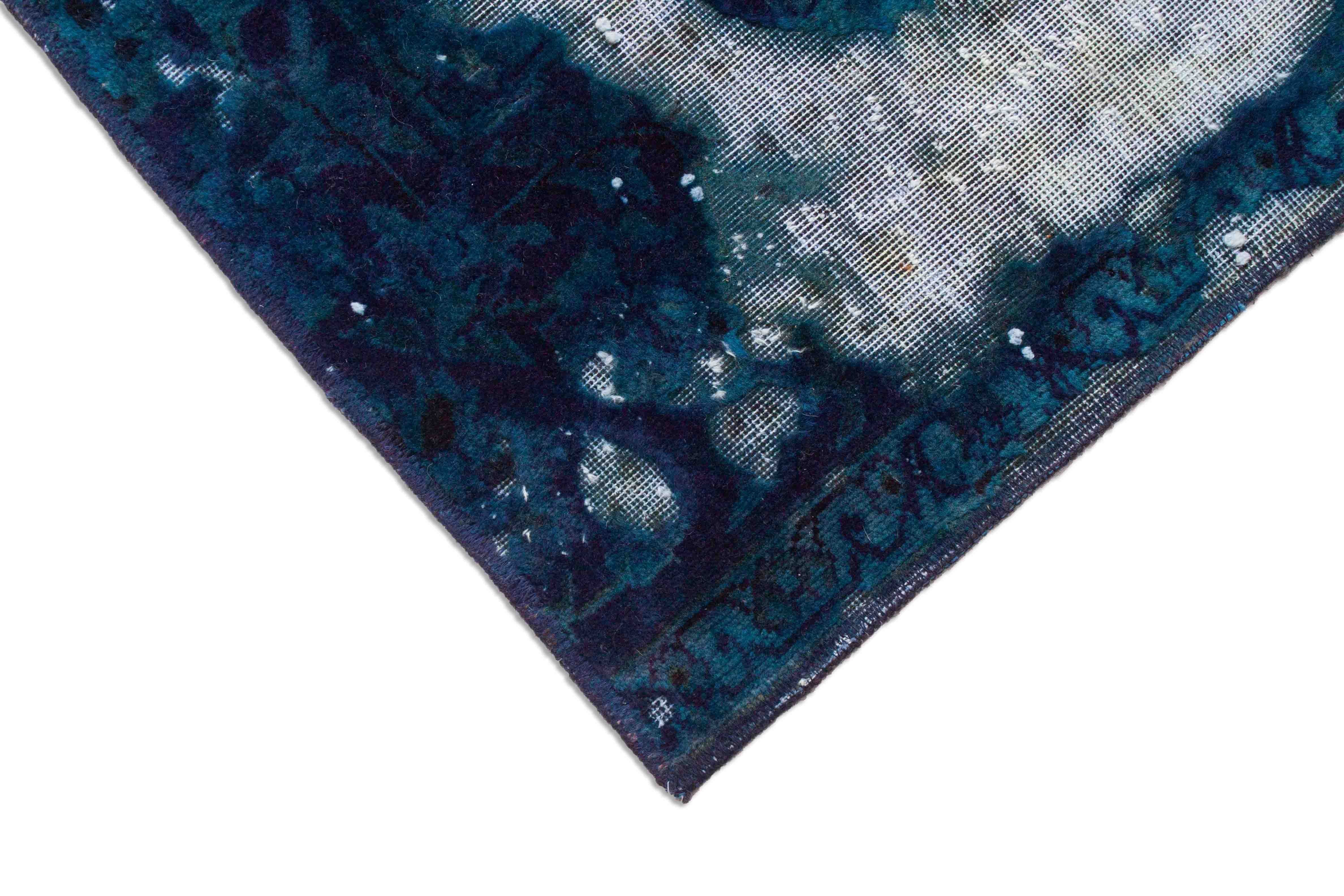 Eine Fotoaufnahme eines Vintage Teppich Teppichs.