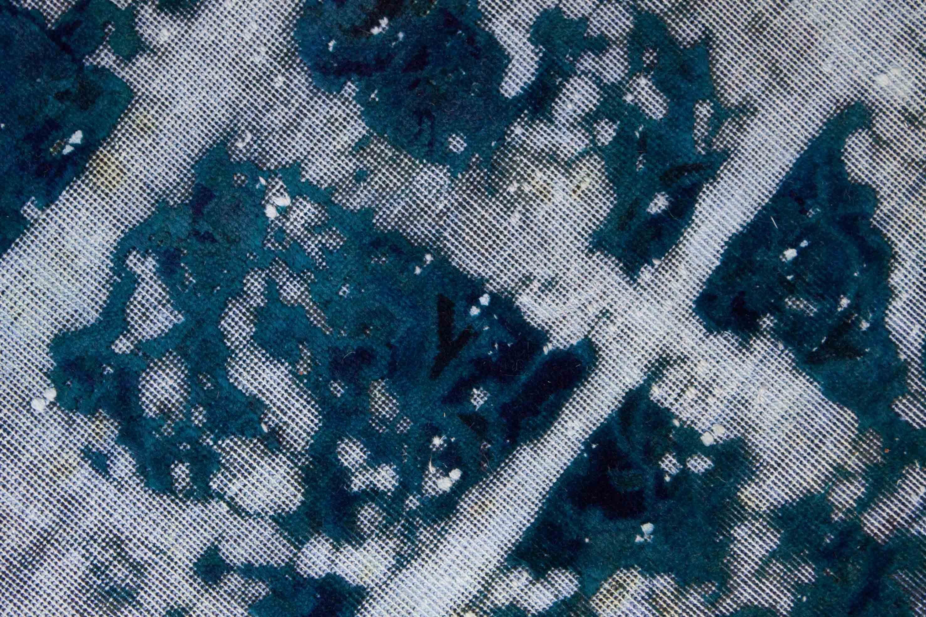 Eine Fotoaufnahme eines Vintage Teppich Teppichs.