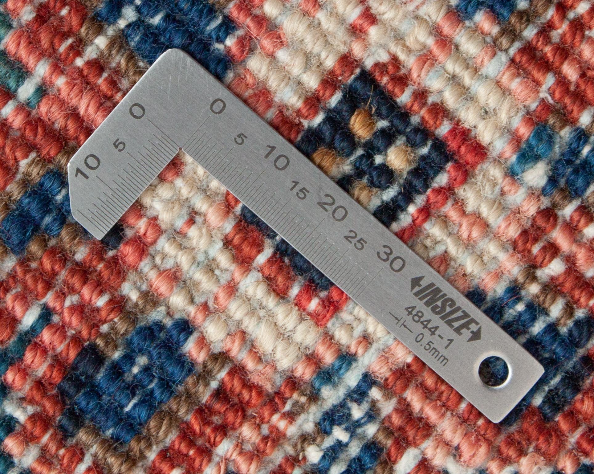 Eine Fotoaufnahme eines Heriz Teppichs.