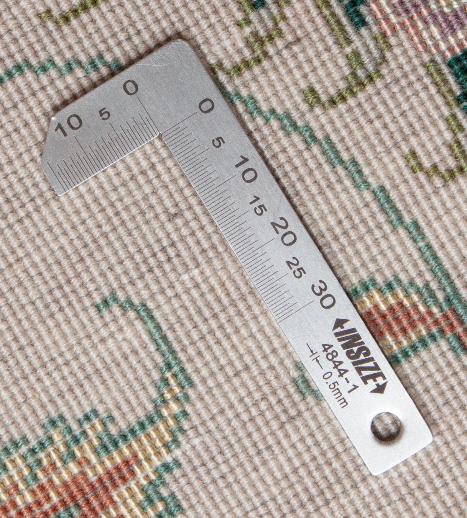 Eine Fotoaufnahme eines Täbriz Teppichs.