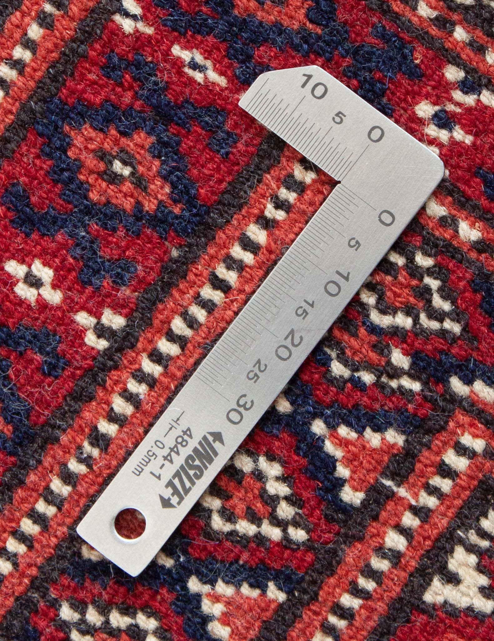 Eine Fotoaufnahme eines Buchara Teppichs.