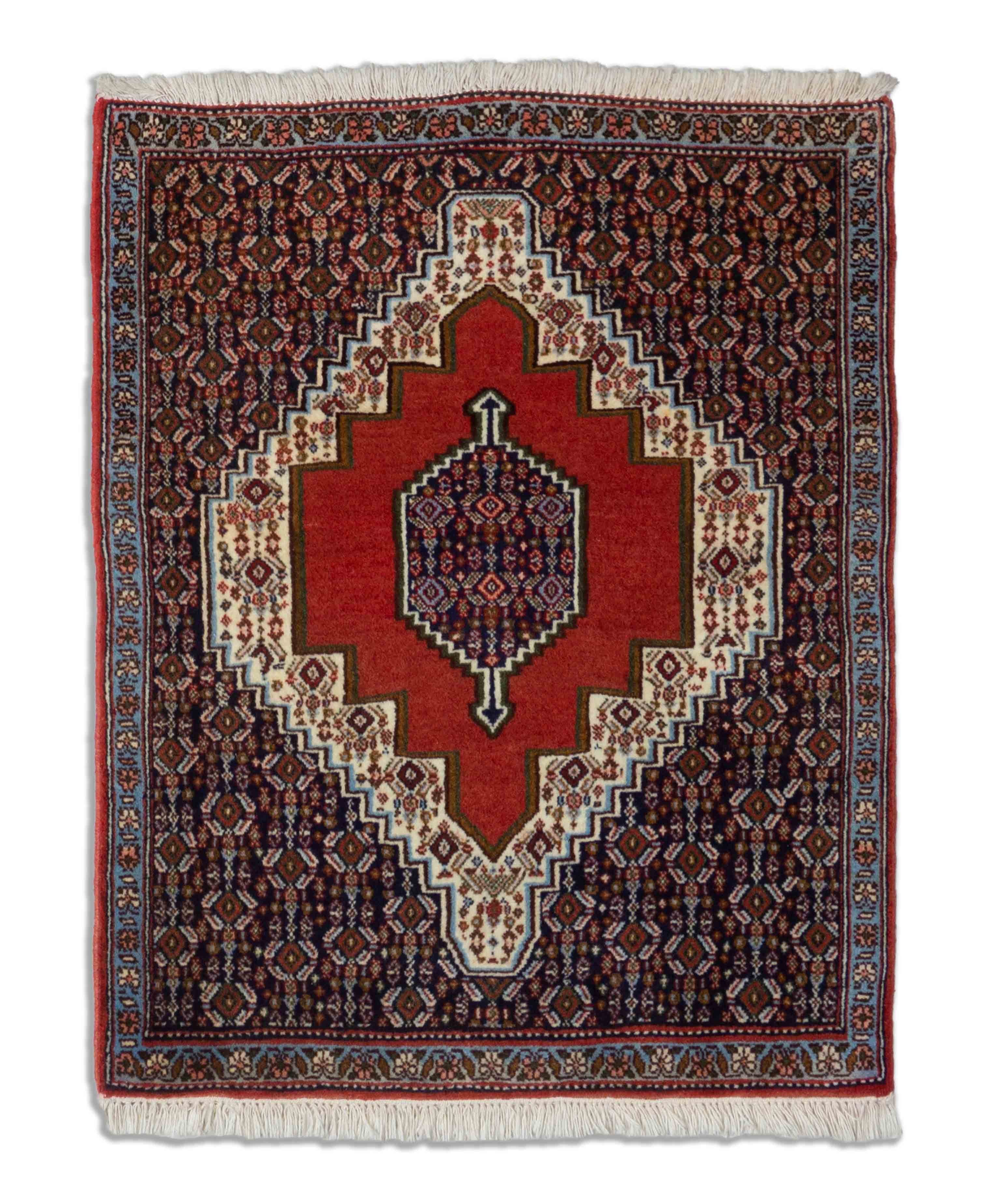 Eine Fotoaufnahme eines Senneh Teppichs.