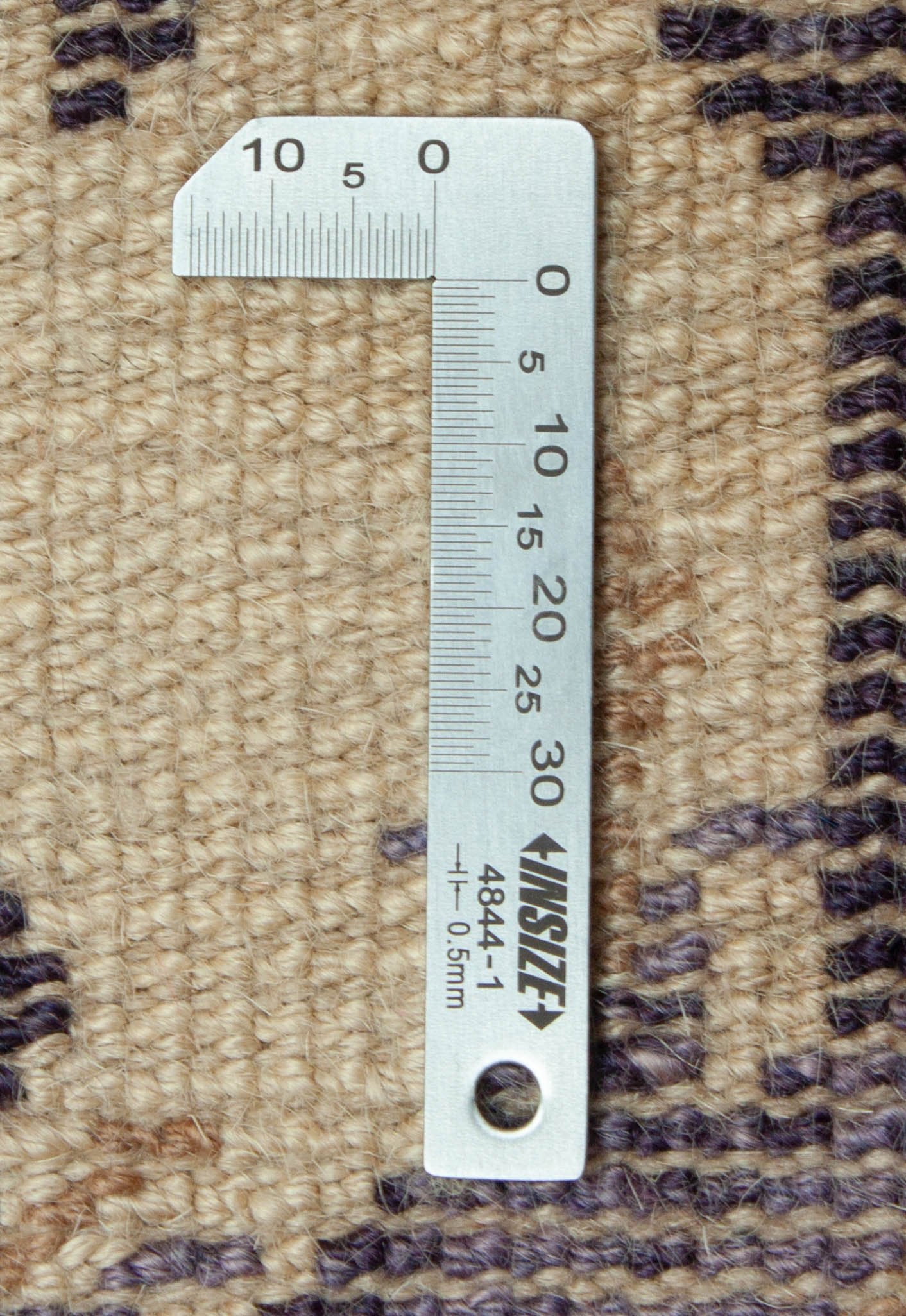 Eine Fotoaufnahme eines US Import China Teppich Teppichs.