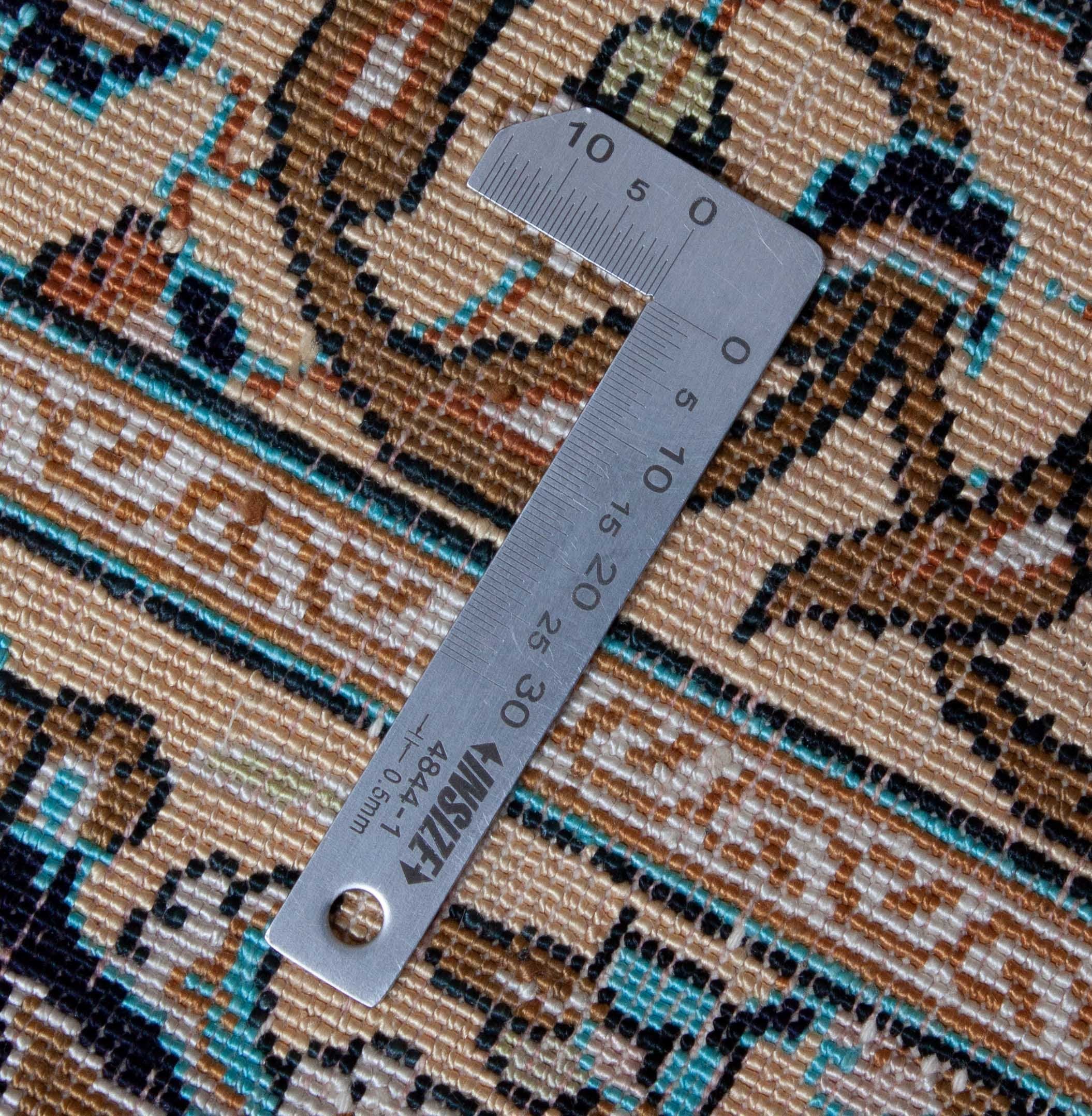 Eine Fotoaufnahme eines Ghom Teppichs.