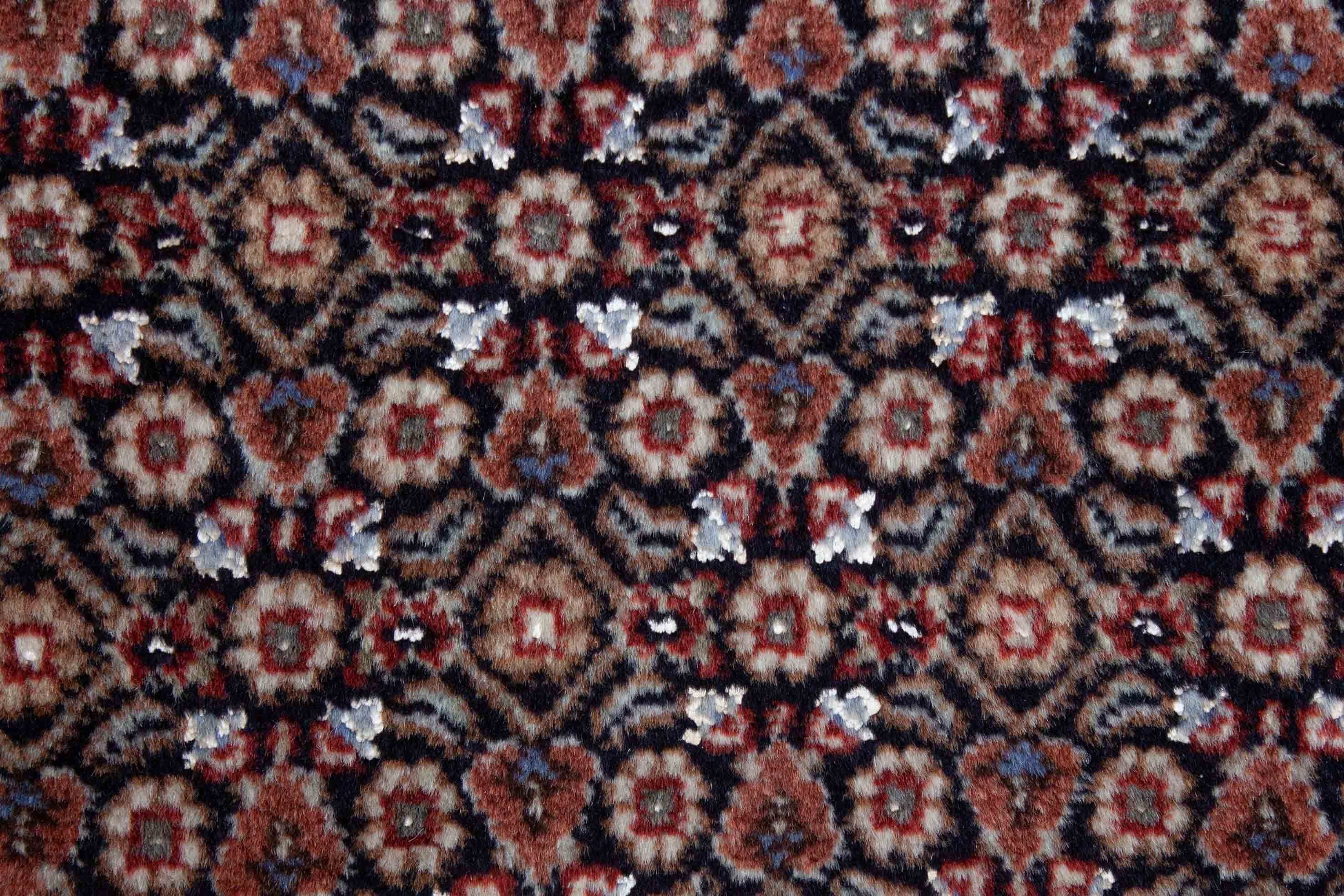 Eine Fotoaufnahme eines Täbriz Teppichs.