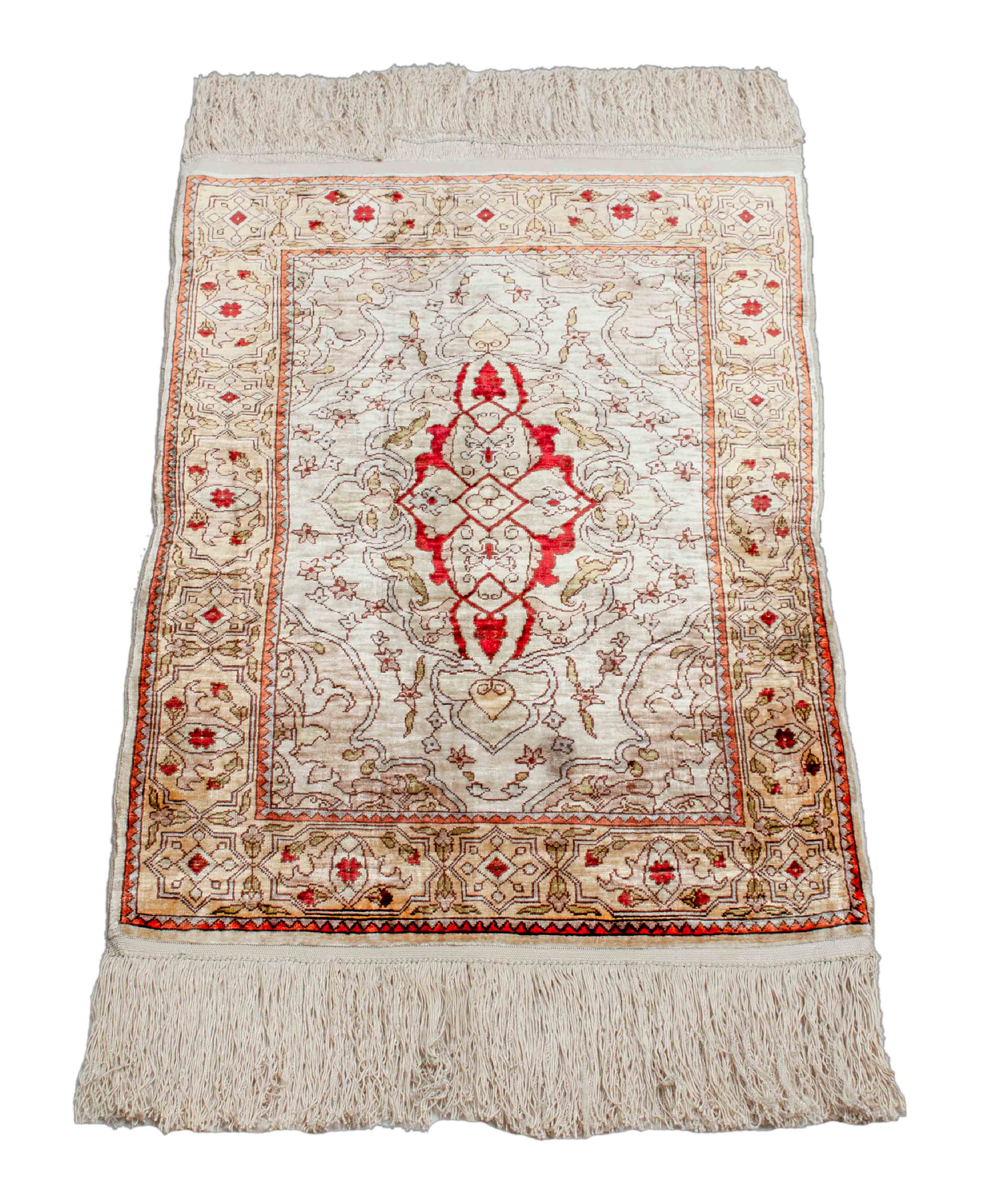 Eine Fotoaufnahme eines Hereke Teppichs.