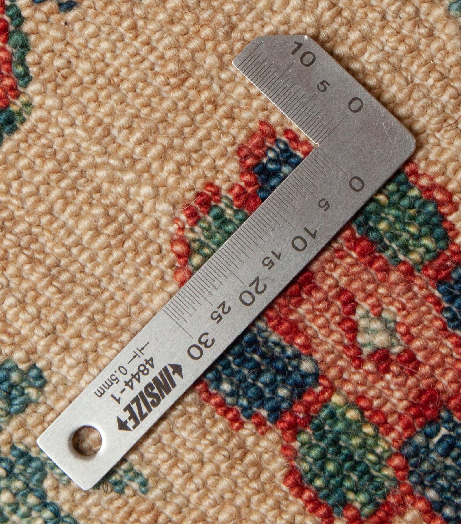 Eine Fotoaufnahme eines Kazak Teppichs.