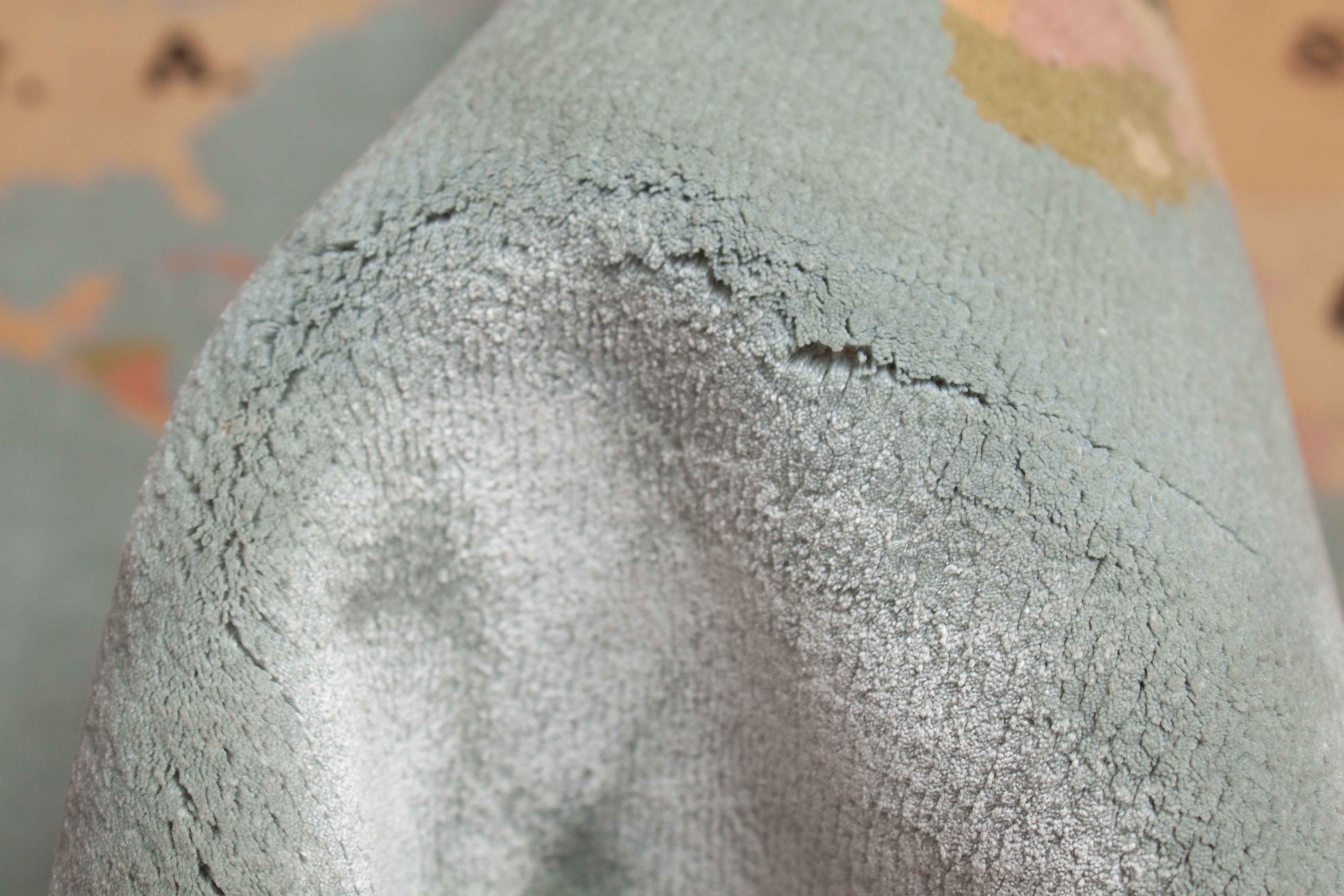 Eine Fotoaufnahme eines China Teppich Teppichs.