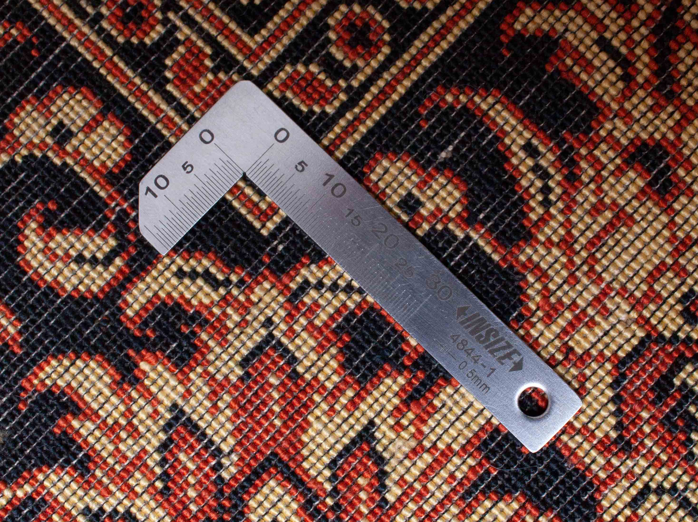 Eine Fotoaufnahme eines Ghom Teppichs.