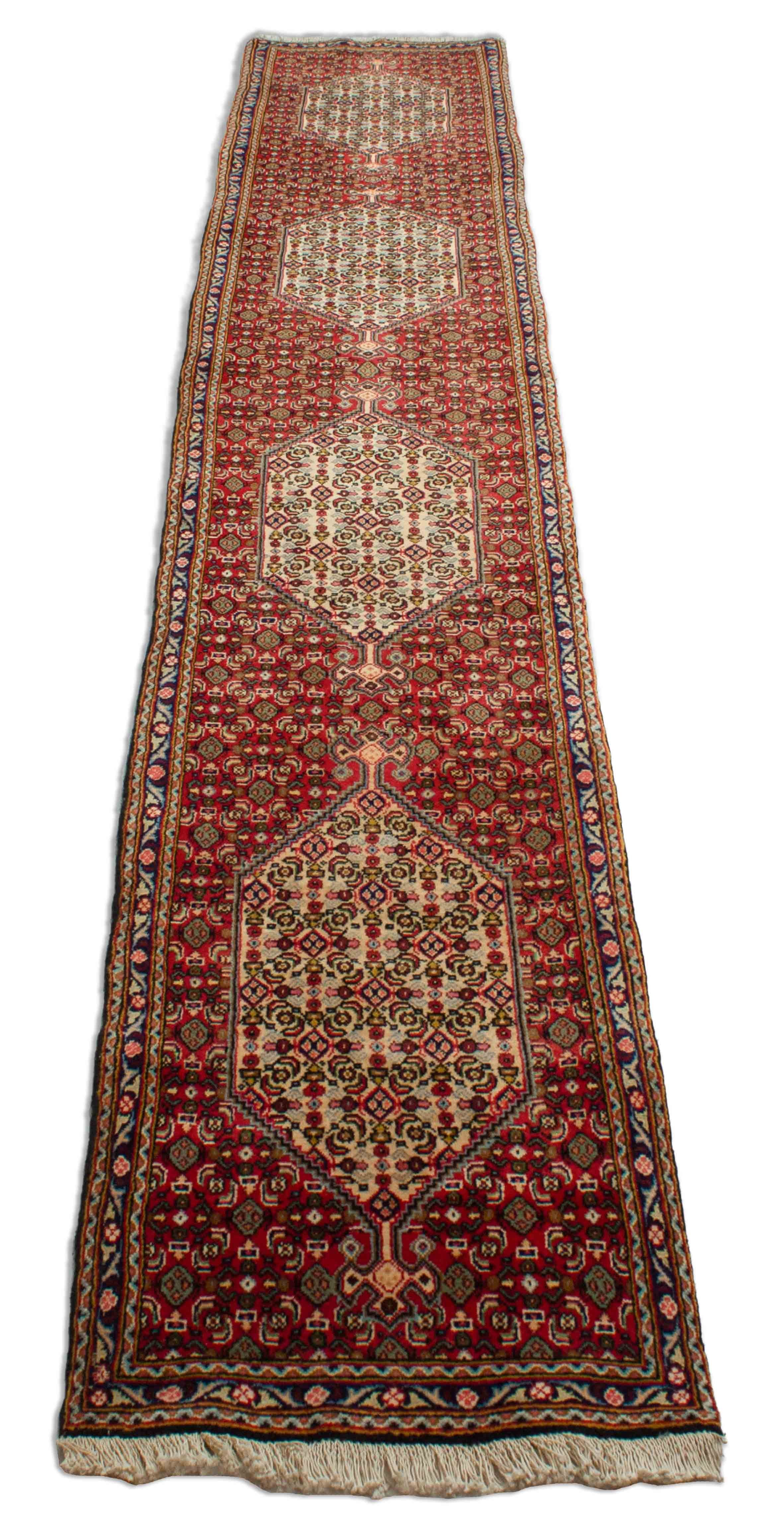 Eine Fotoaufnahme eines Senneh Teppichs.