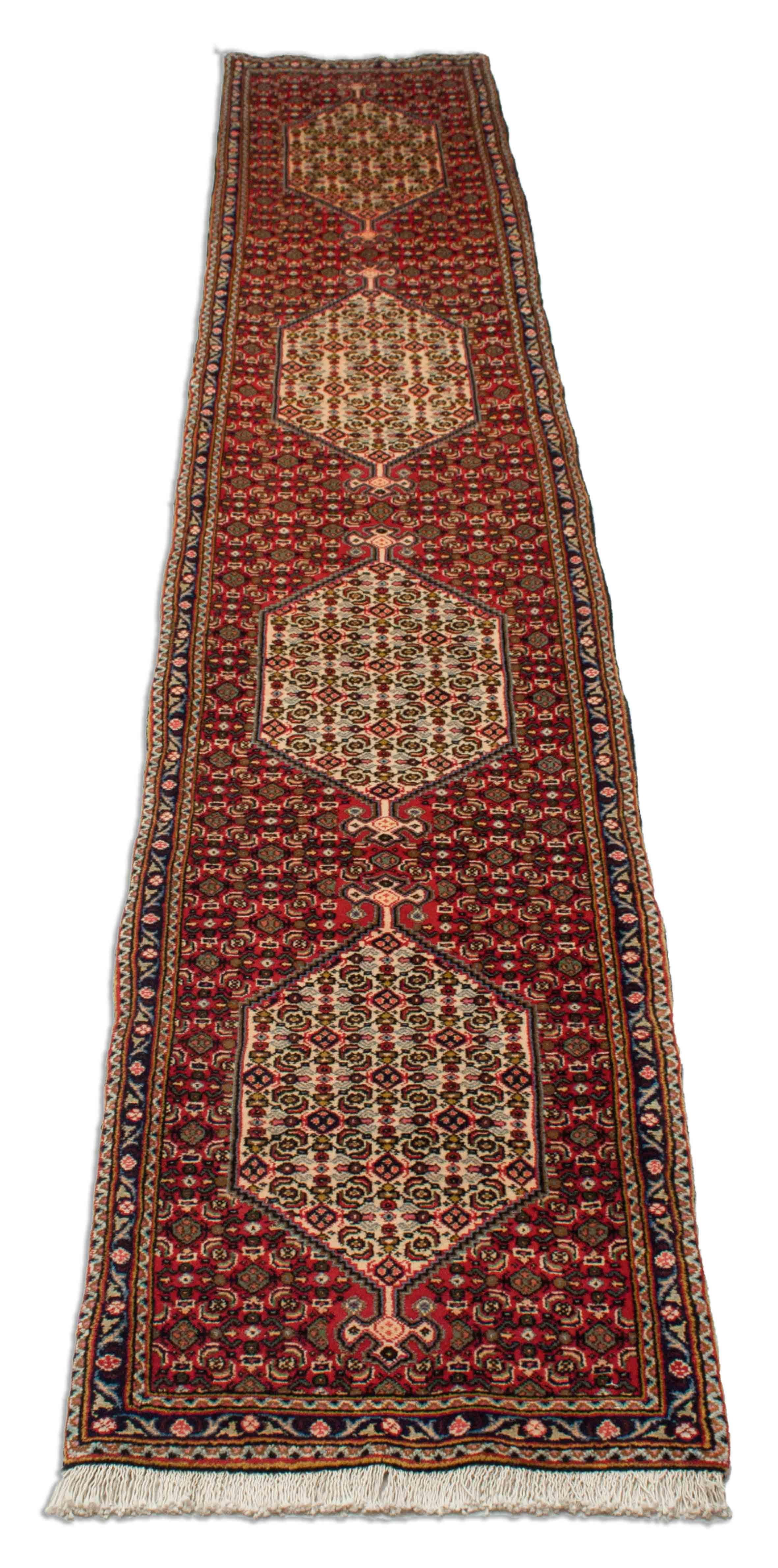 Eine Fotoaufnahme eines Senneh Teppichs.