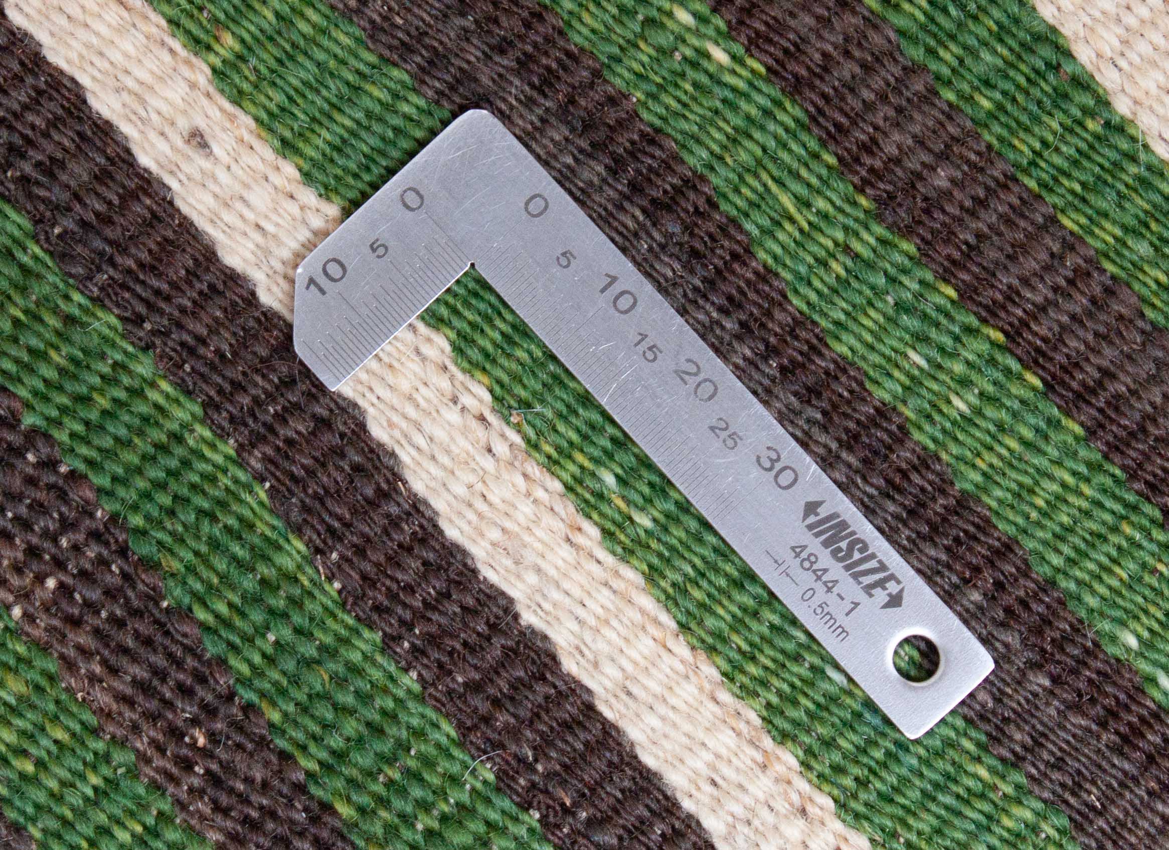 Eine Fotoaufnahme eines Kelim Teppichs.