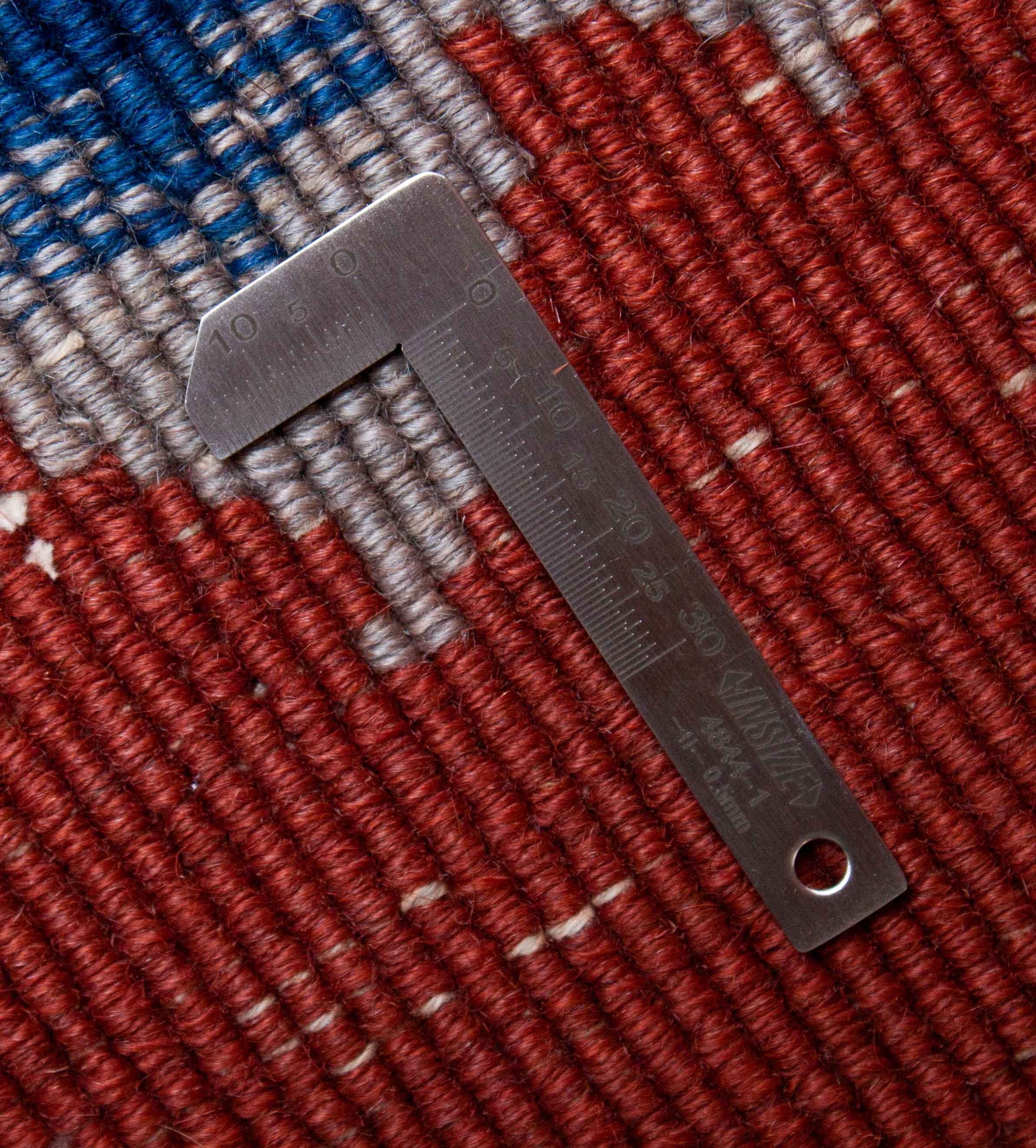 Eine Fotoaufnahme eines US Import China Teppich Teppichs.