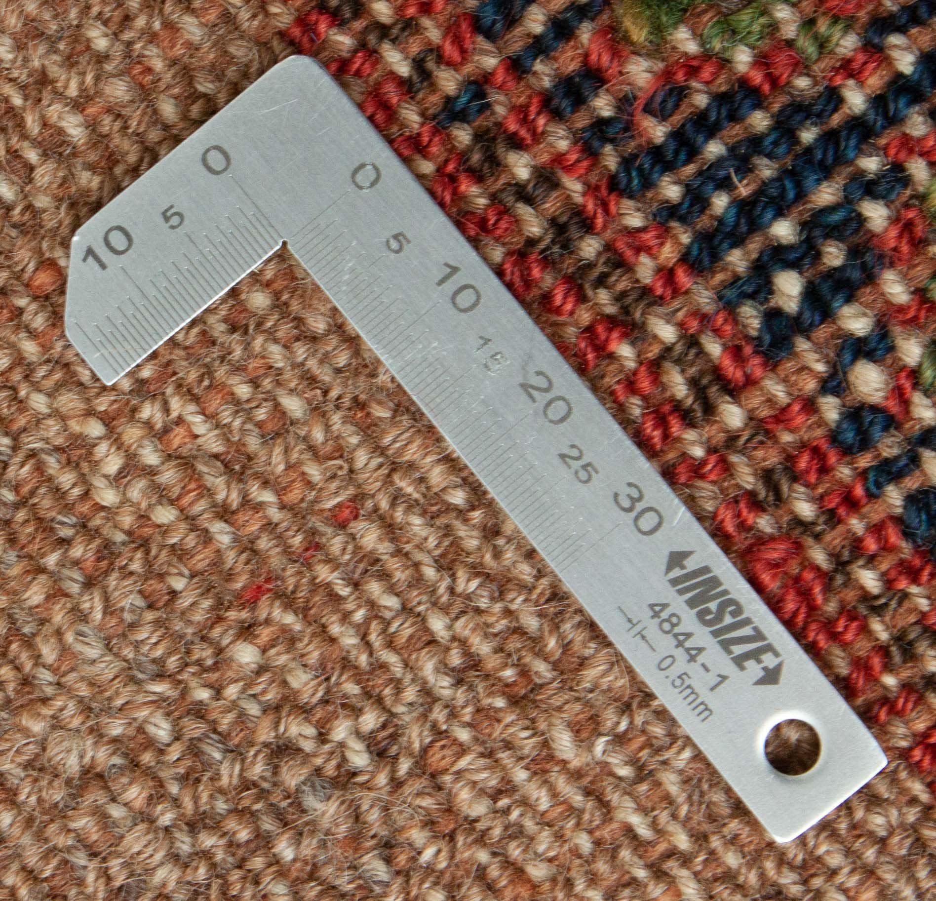 Eine Fotoaufnahme eines Hamadan Teppichs.