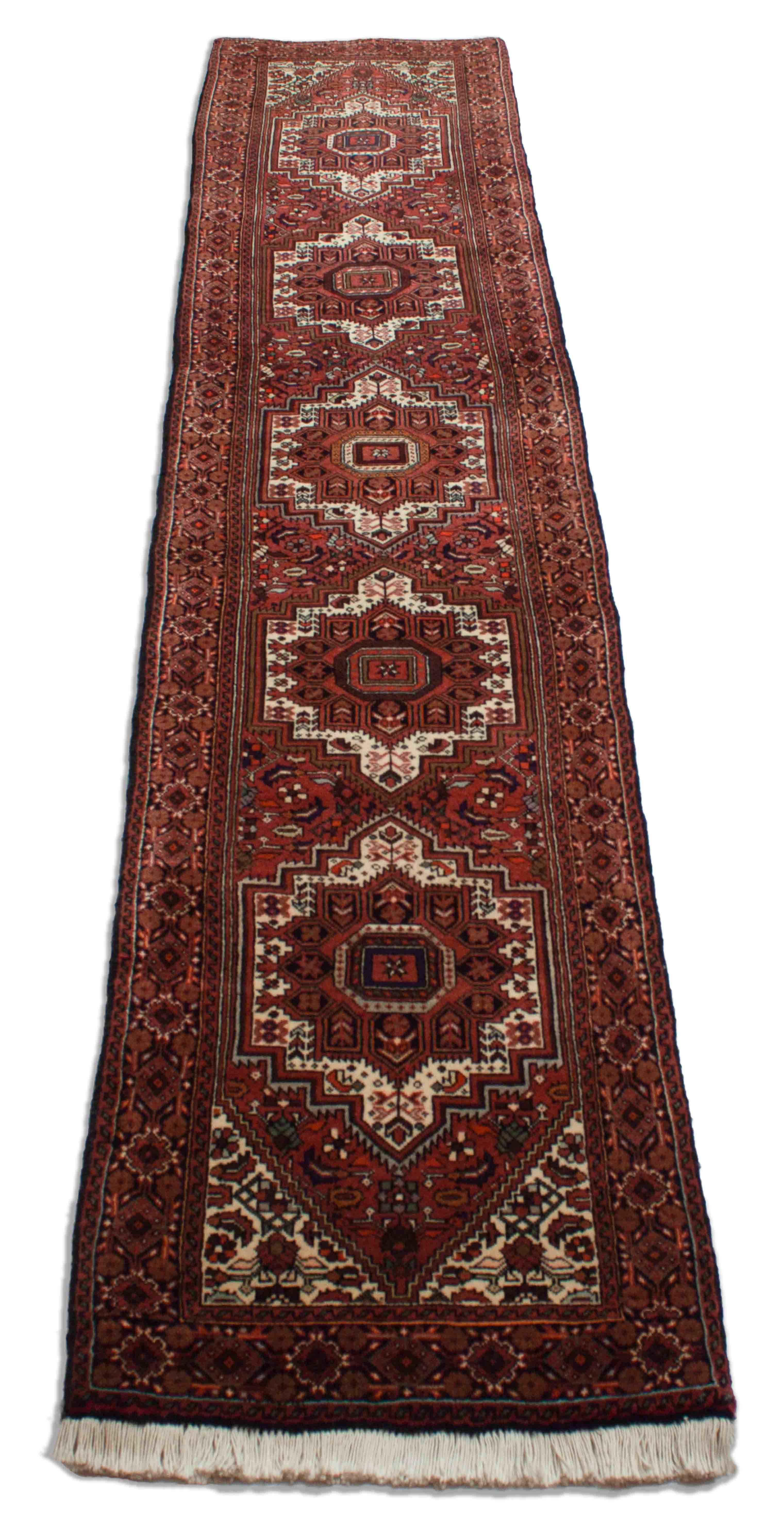 Eine Fotoaufnahme eines Goltogh Teppichs.