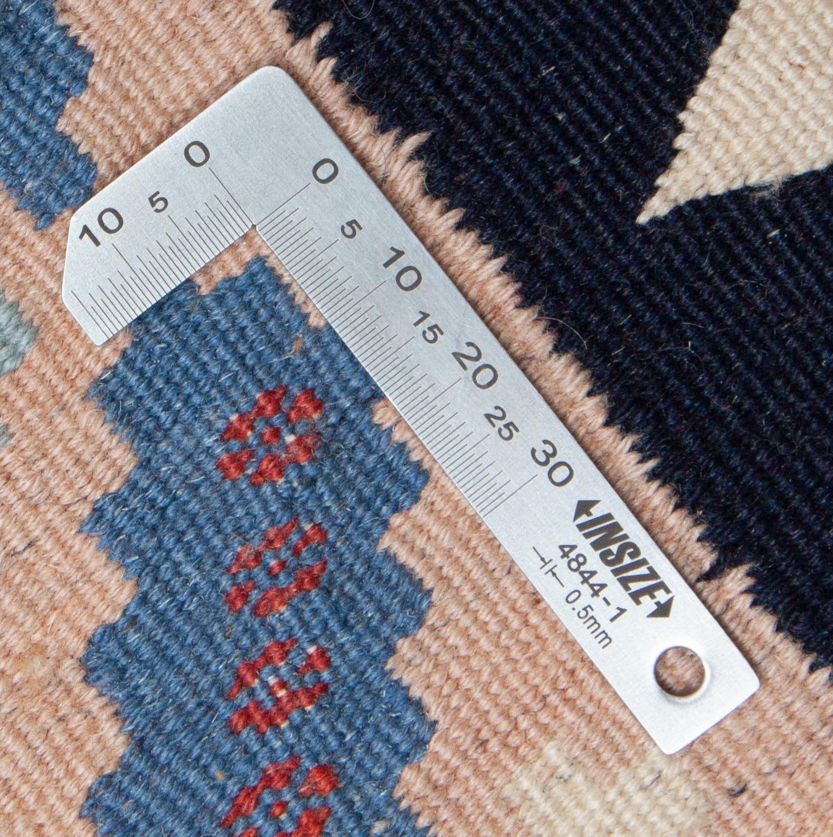 Eine Fotoaufnahme eines Sofreh Teppichs.