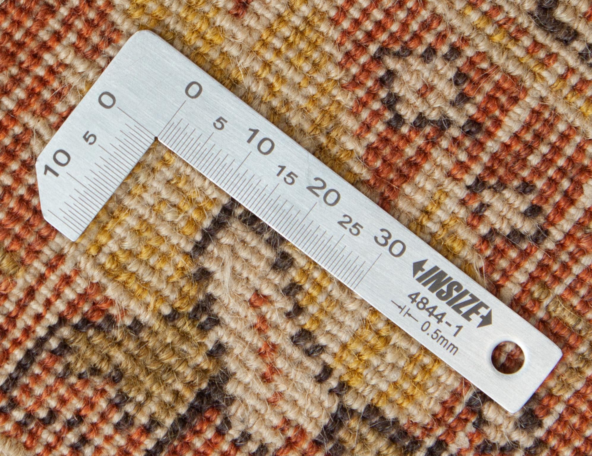 Eine Fotoaufnahme eines Täbriz Teppichs.