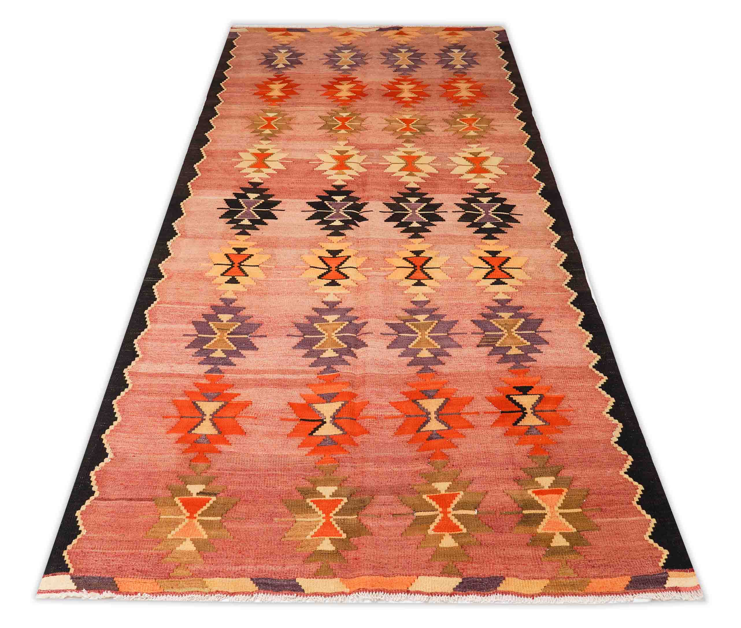 leicht eingerahmter Kelim Teppich in dunkelrot und 310 cm x 154 cm groß