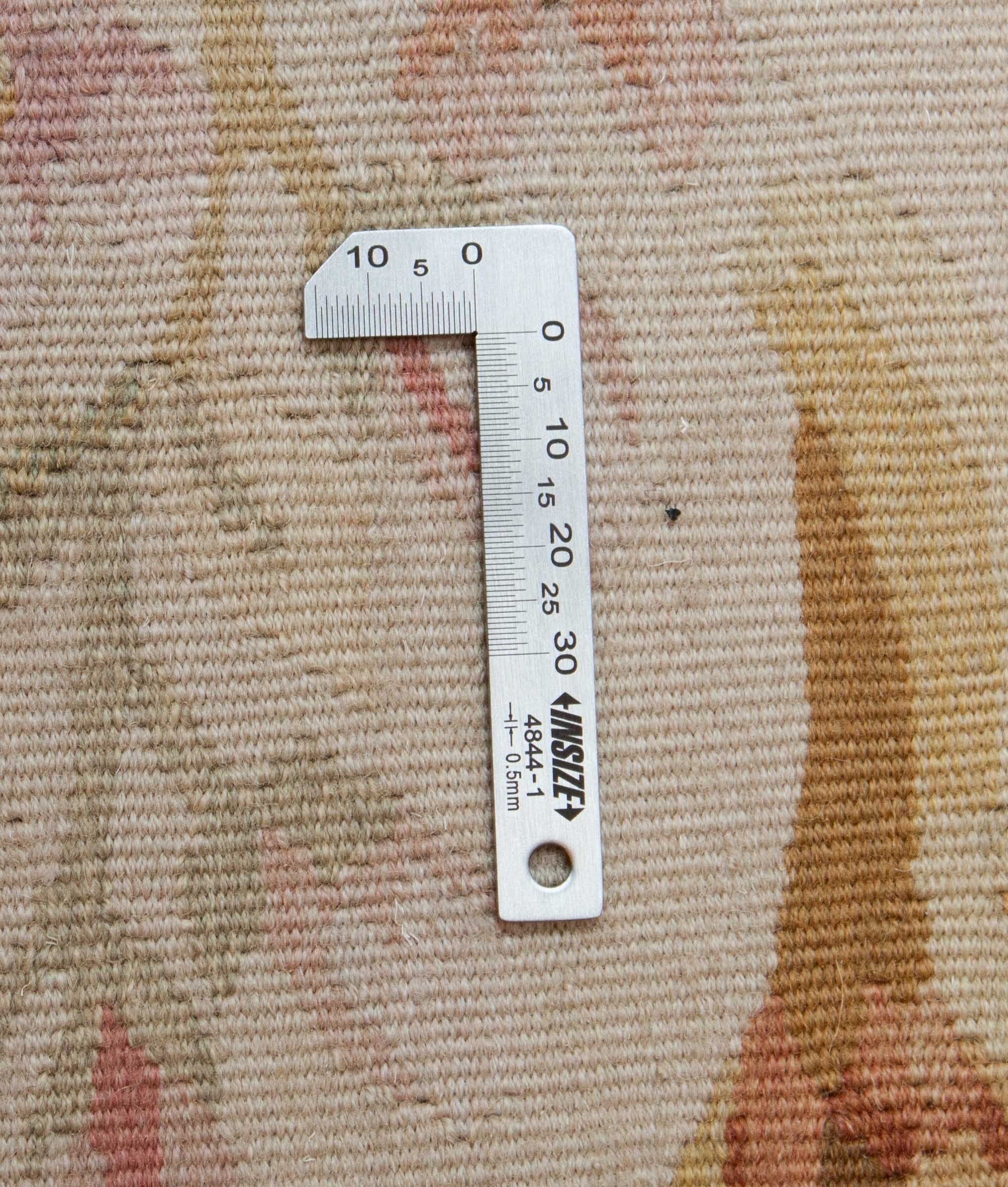 Eine Fotoaufnahme eines Aubusson Teppichs.